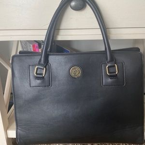 Anne Klein black purse with white pocka dots lined inside and gold logo purse.